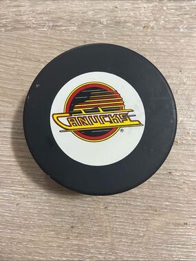 VTG Vancouver Canucks NHL Official Game Hockey Puck Canada Trench John Ziegler